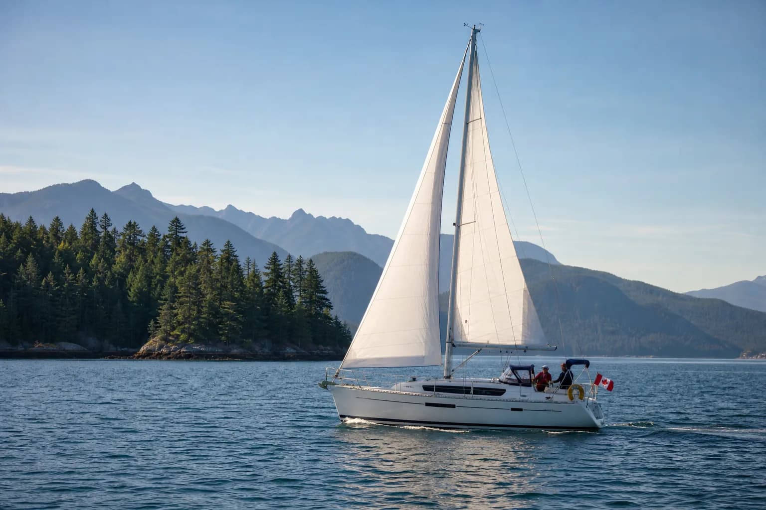 Illustrative Canadian coastal scene with a cruising yacht, forested islands and mountains.